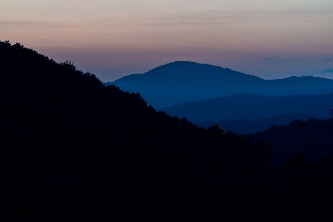 Layered silhouettes of the Appalachian mountains at dusk